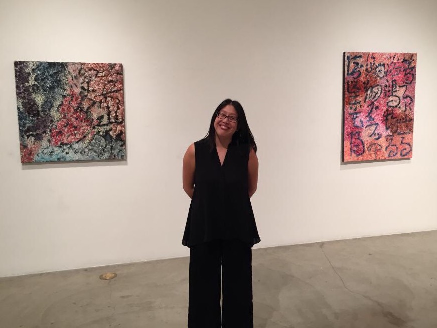 Patricia Chow with her paintings.